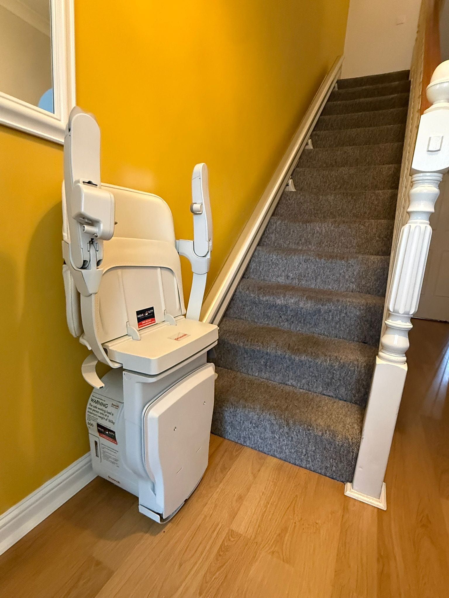 Urgent Stairlift Installation Stairlift installed on carpeted staircase indoors